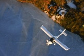Inflight over frozen lake from above